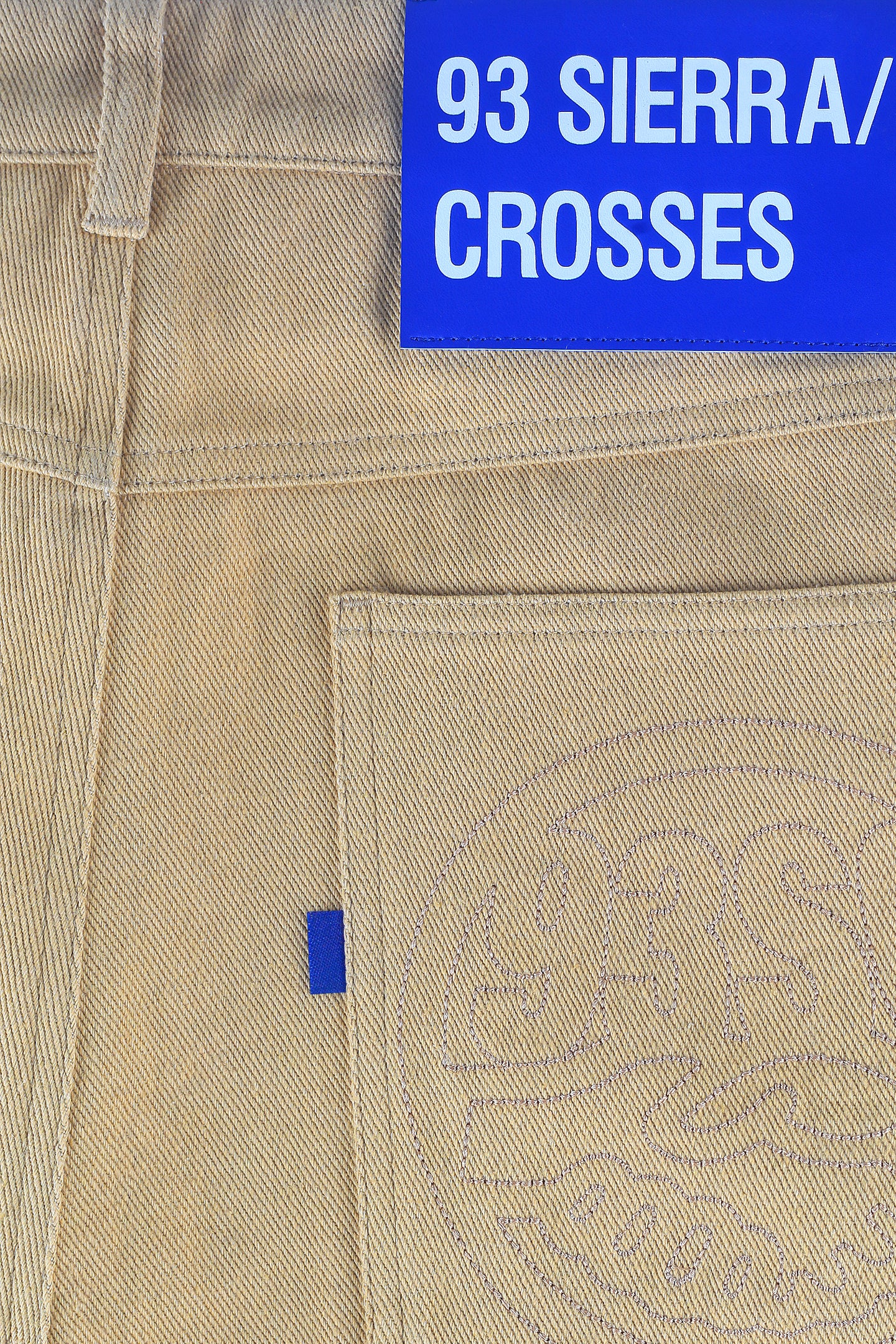 Klein blue leather patch label and embroised holding hands logo jeans 93 sierra crosses close view