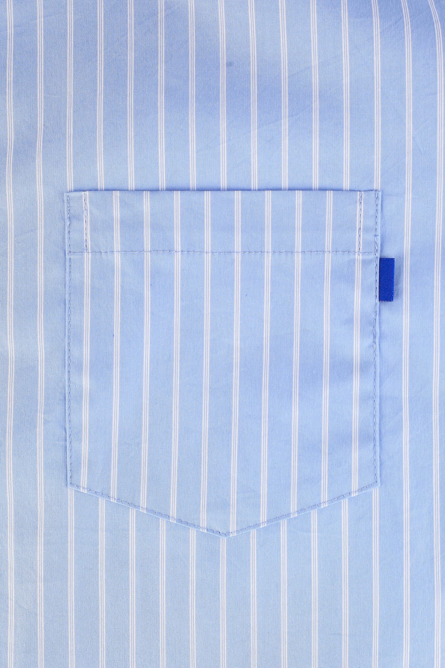 A pocket of a blue and white striped shirt with a distinctive small blue tag of the brand 