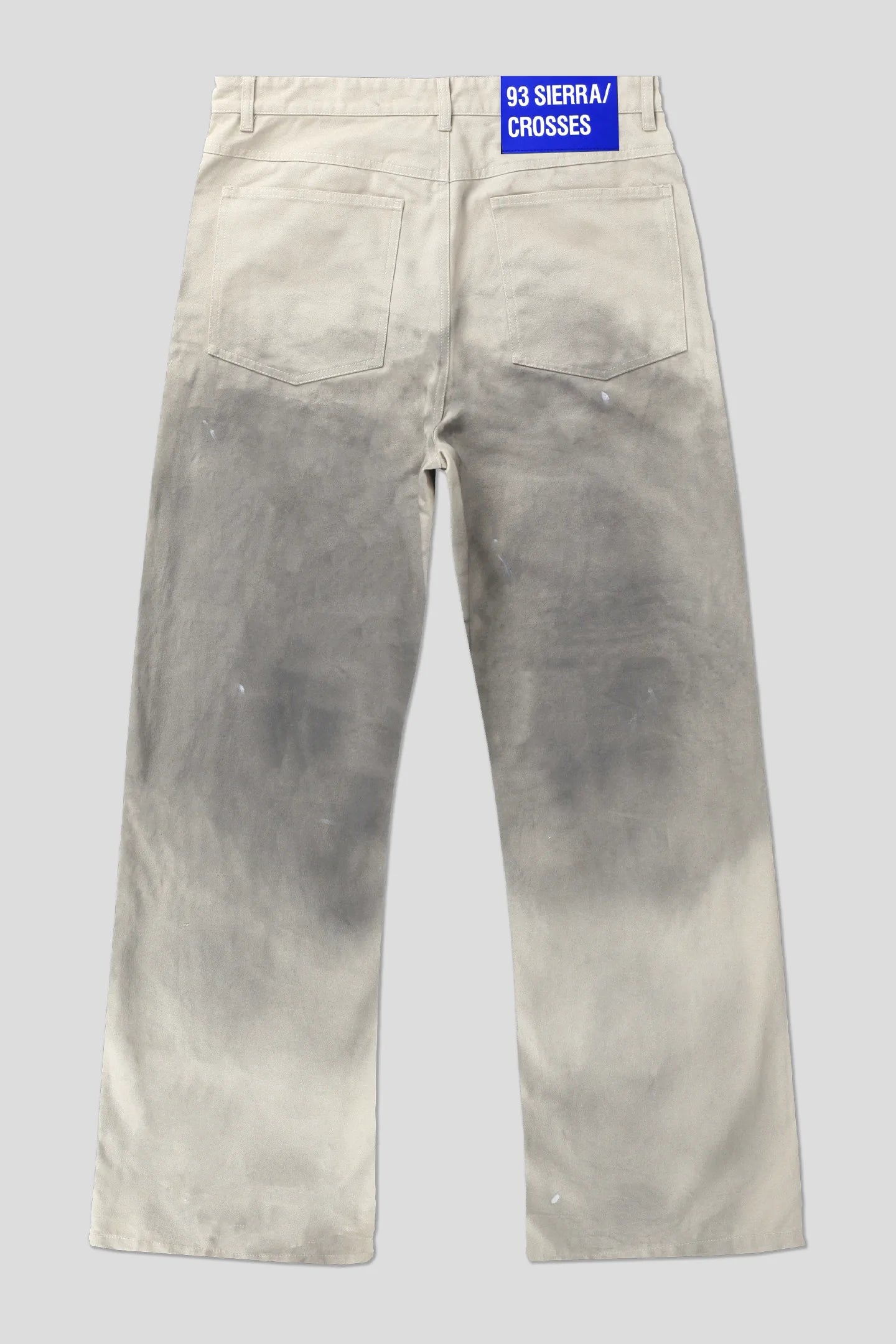 Ecru dirt wash work pants with blue 93 SIERRA/CROSSES waistband label, product back view