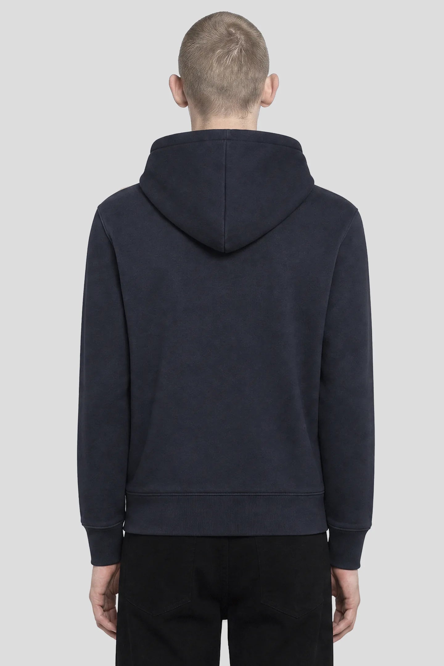 Model wearing the Cross Navy Zip Hoodie with red cross chest embroidery, front view 93 SIERRA/CROSSES