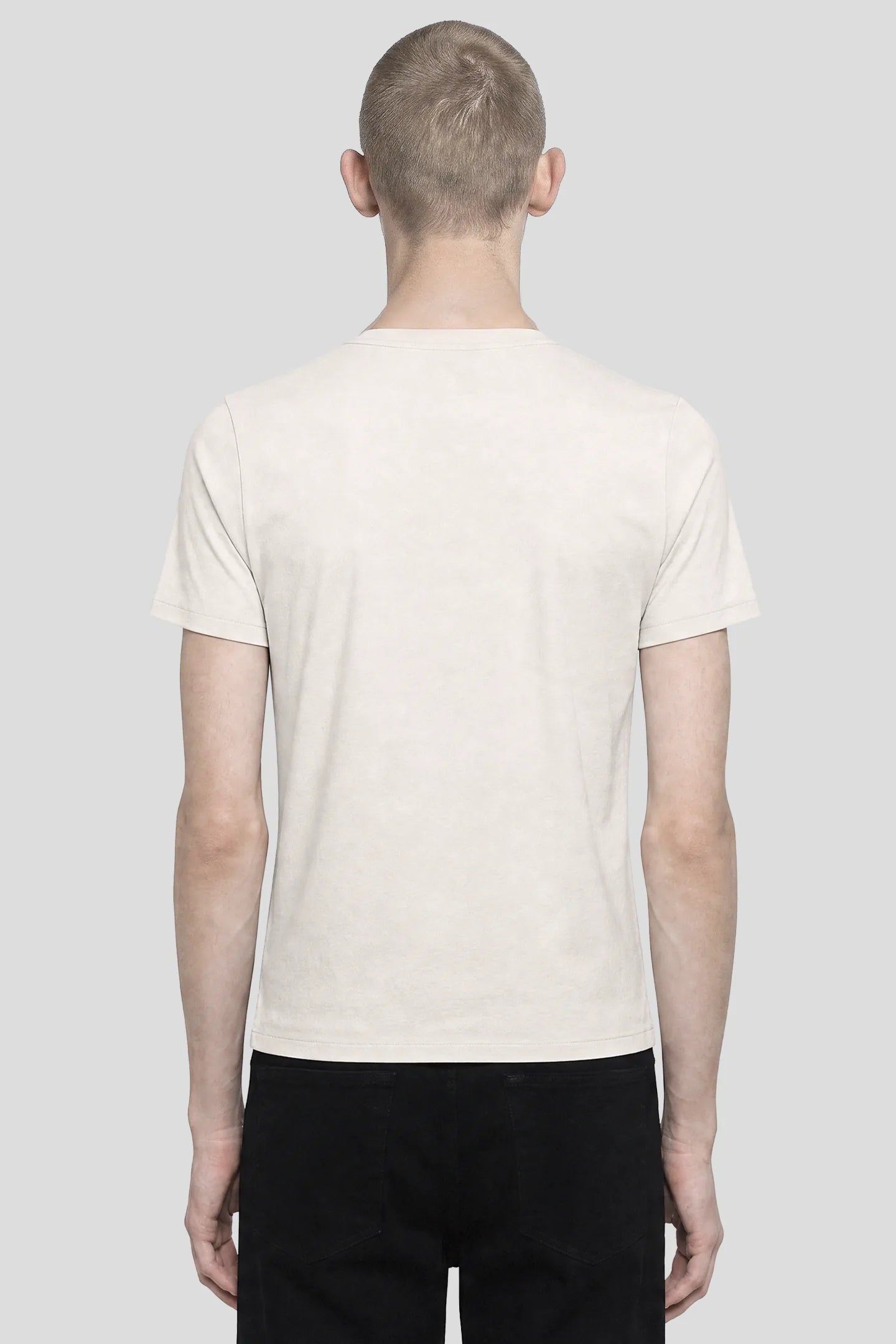 Model wearing the 93SC Signature White T-Shirt, a 100% cotton crew neck tee, front view by 93 SIERRA/CROSSES